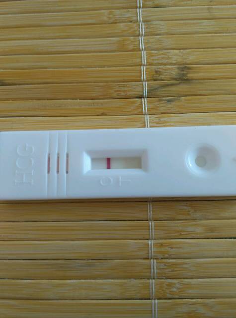 月经推迟五天了,_白带多,胸部痛。今天早上测